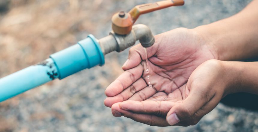 Men hand are waiting to drink water in the water shortage.